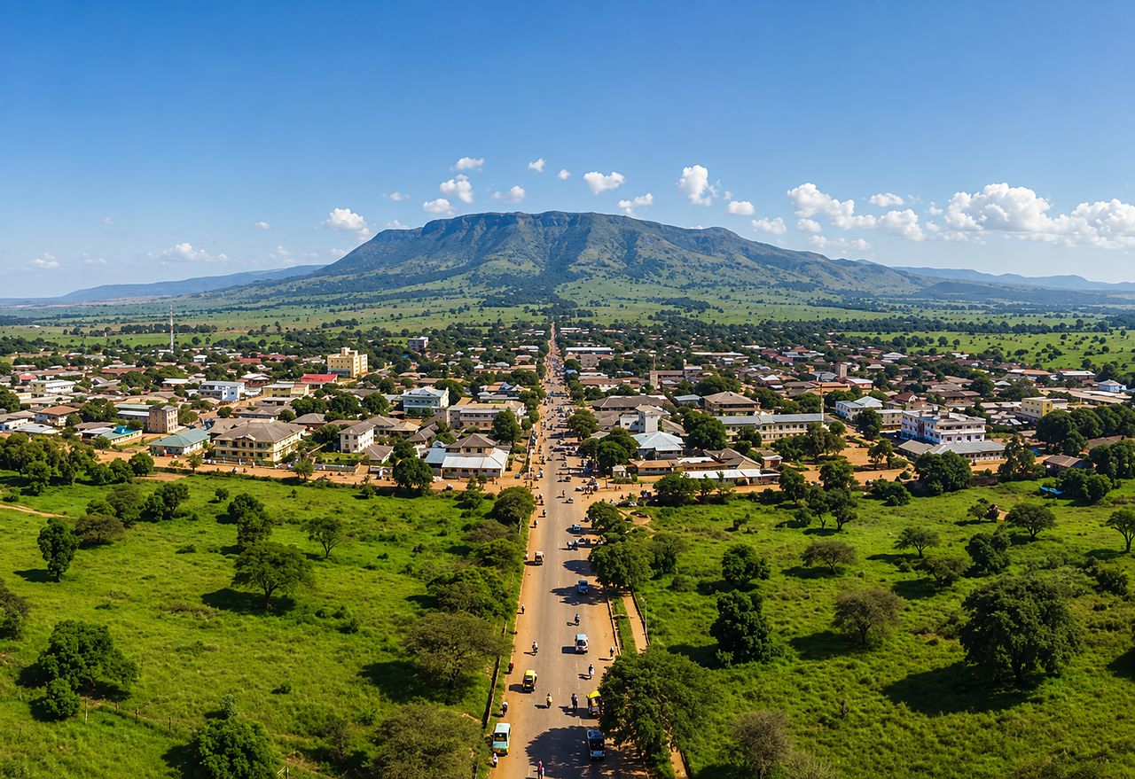 Aerial view of Morogoro, with the main road running through the town towards the mountains beyond